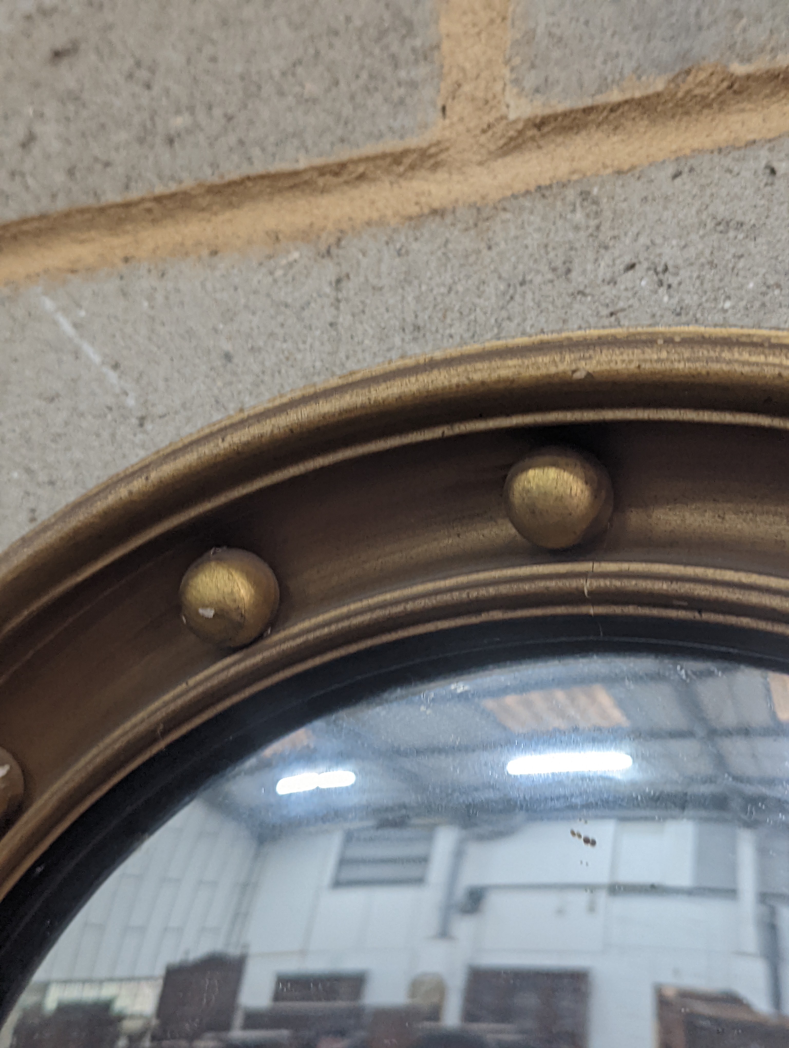 A Regency style circular gilt framed convex wall mirror, diameter 45cm